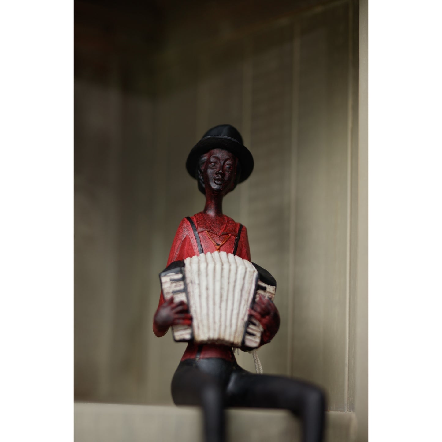 Sitting Squeeze Box Player