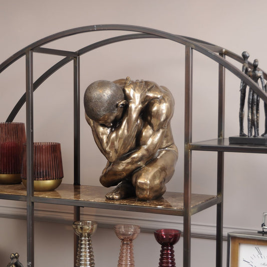 Upscaled Keswick Male Clutching Sculpture